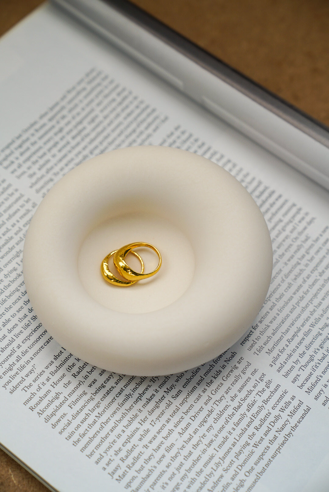 Asymmetric Jewellery Tray with rings in it on a magazine