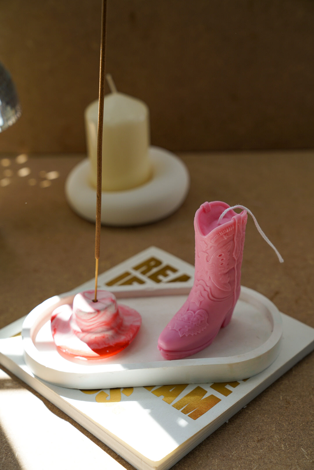 Pink Cowboy Boot Candle and Marble Pink Cowboy Hat Incense Holder in a Ivory trinket dish.