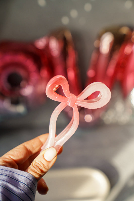 Holding Pink Bow Claw Hair Clip