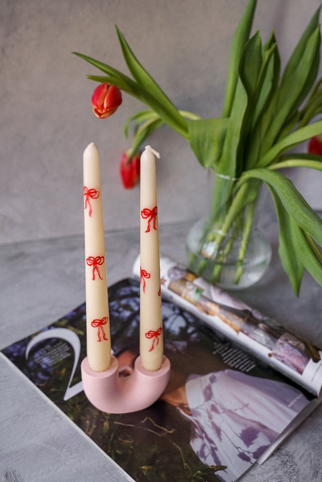 Bow Hand-Painted Pillar Candles / Pink U shape candle holder Tulips at the background