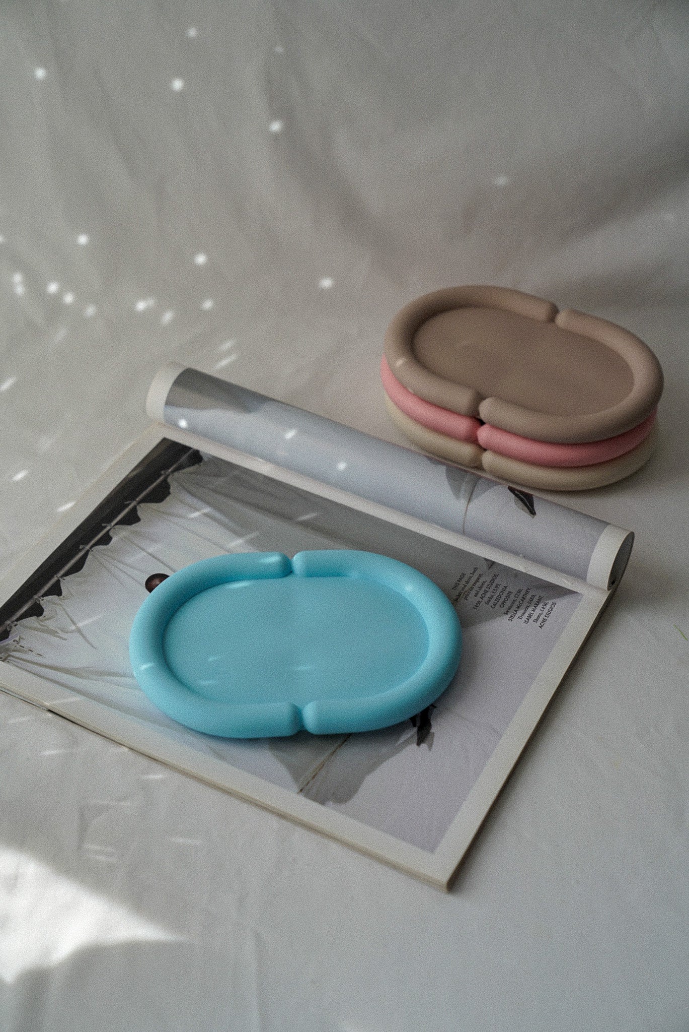 Baby Blue Oval Curvy Jewellery Tray with the other colours on the background.