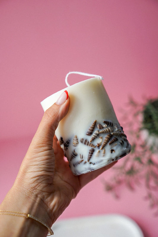 Holding Natural Sea Shell Candles