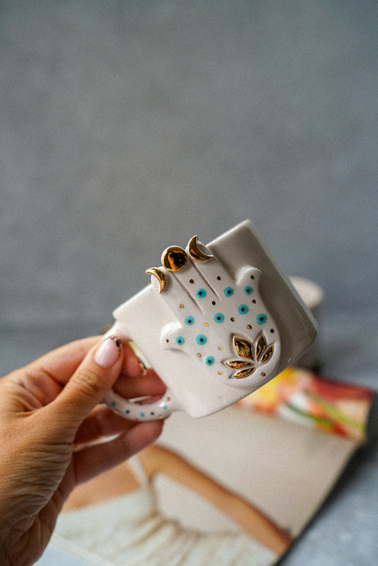 Holdig Hamsa Hand coffee mug
