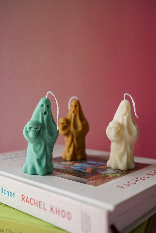 Spooky Ghost Holding Pumpkin Candle