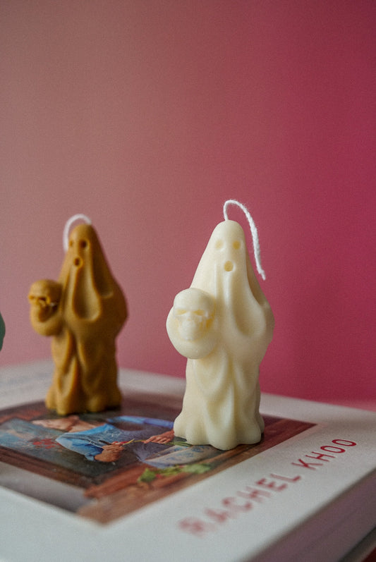 Spooky Ghost Holding Pumpkin Candle