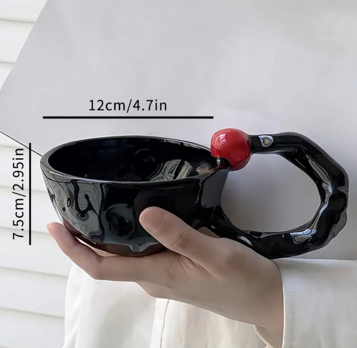 Irregular Coffee Mug with a Large Handle with size written.
