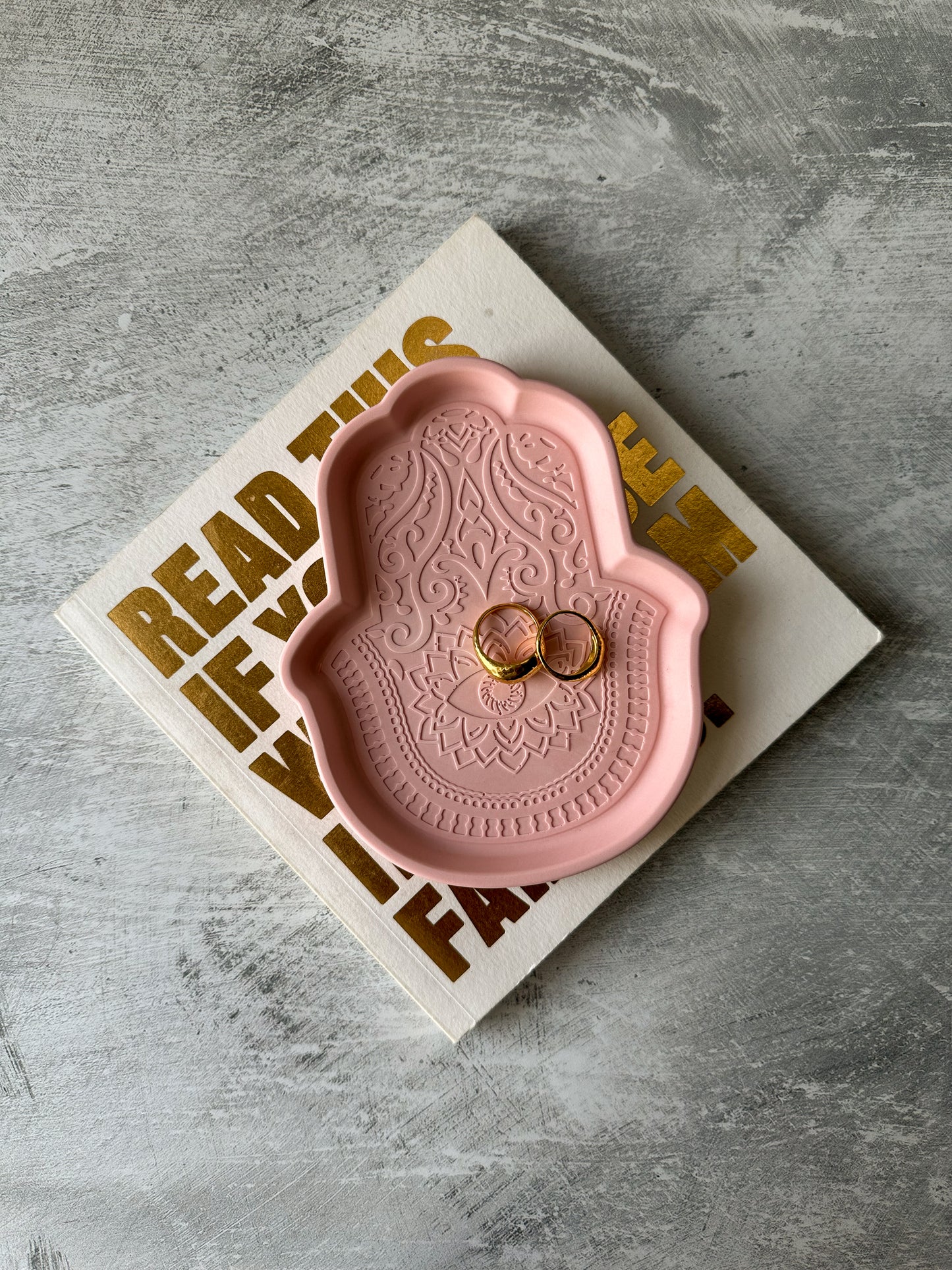 Fatima Hand Jewellery Tray with rings in it.