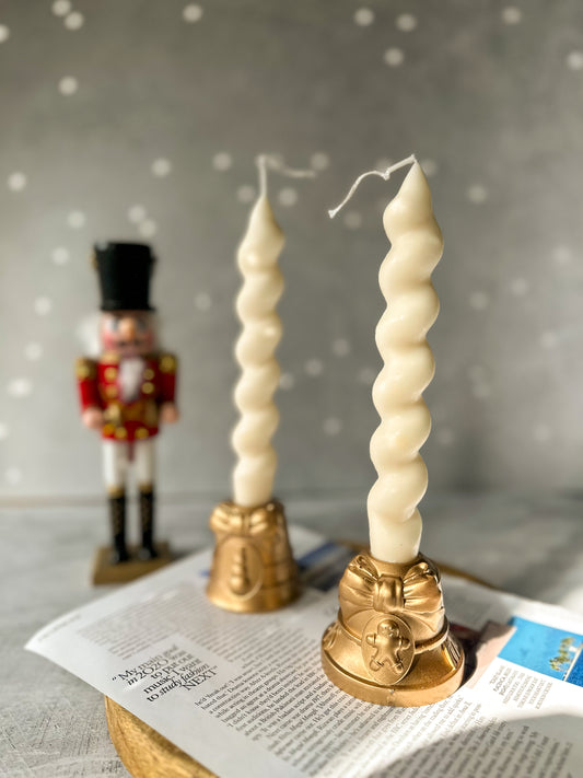 Christmas Candle Holders with Gingerbread detailed and spiral candle on it.