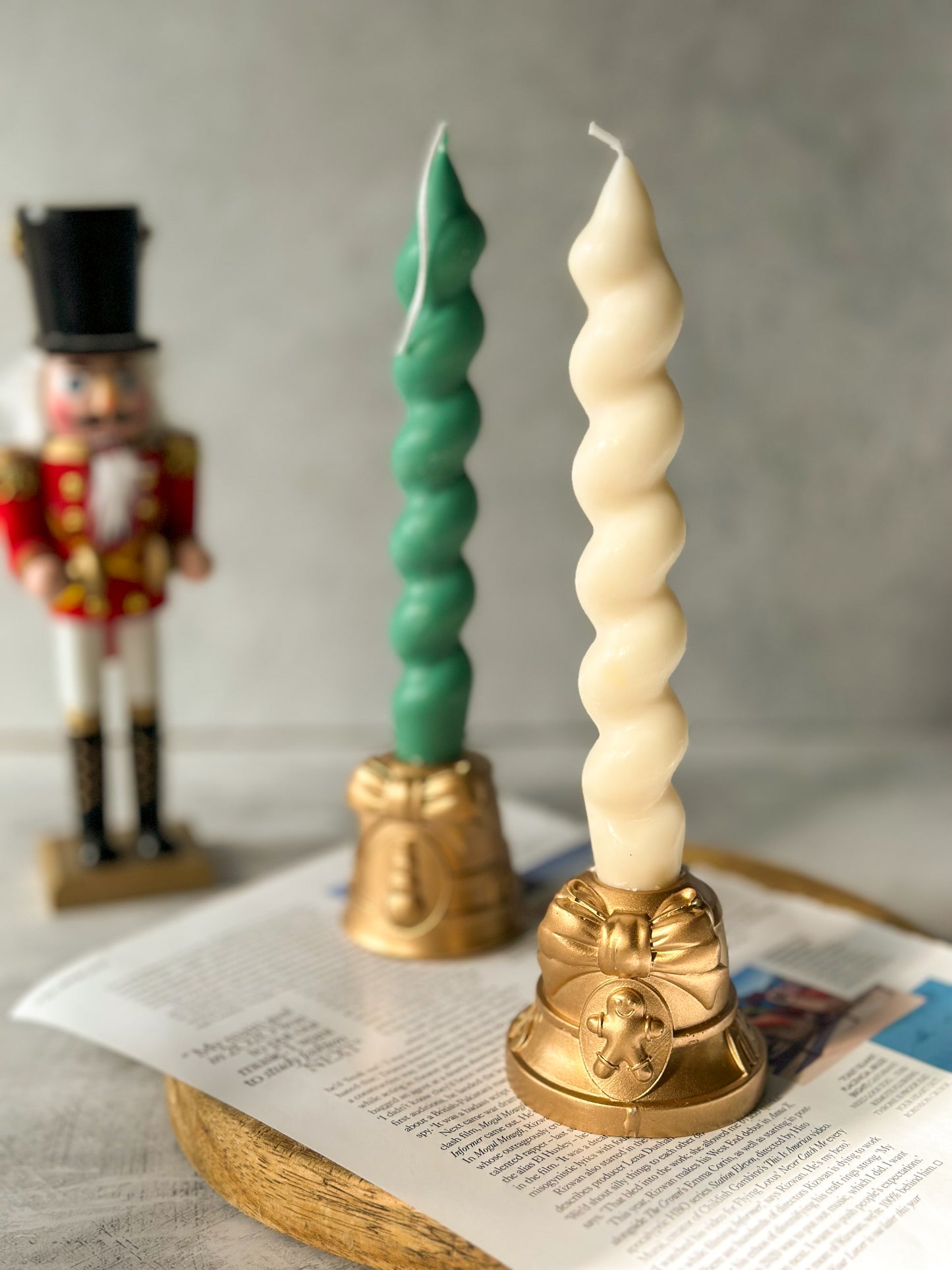 Gold Christmas Candle Holders With Gingerbread on it twisted candle on it.