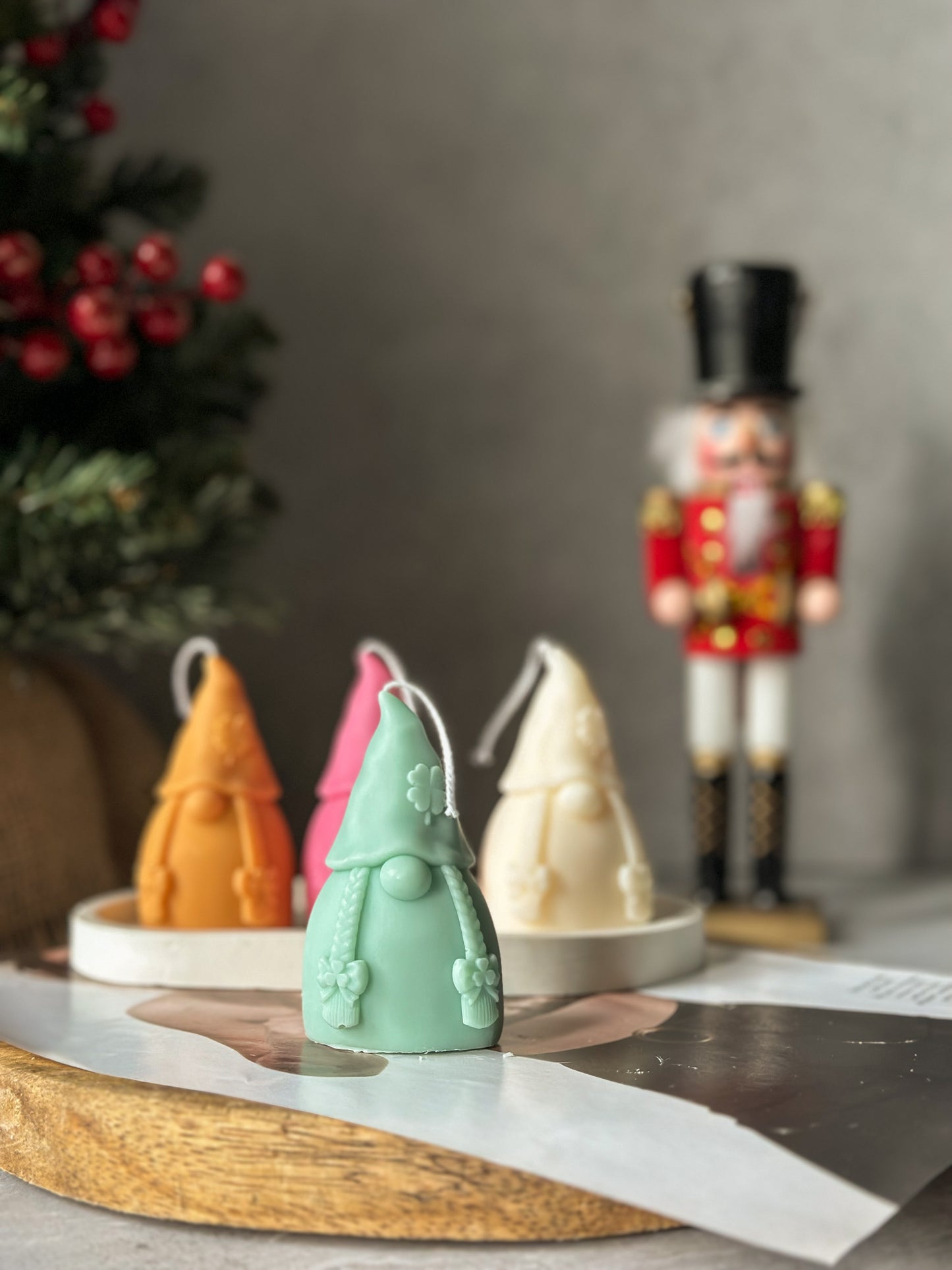 Green Gnome Scented Candles with nutcracker and Christmas tree on the back.