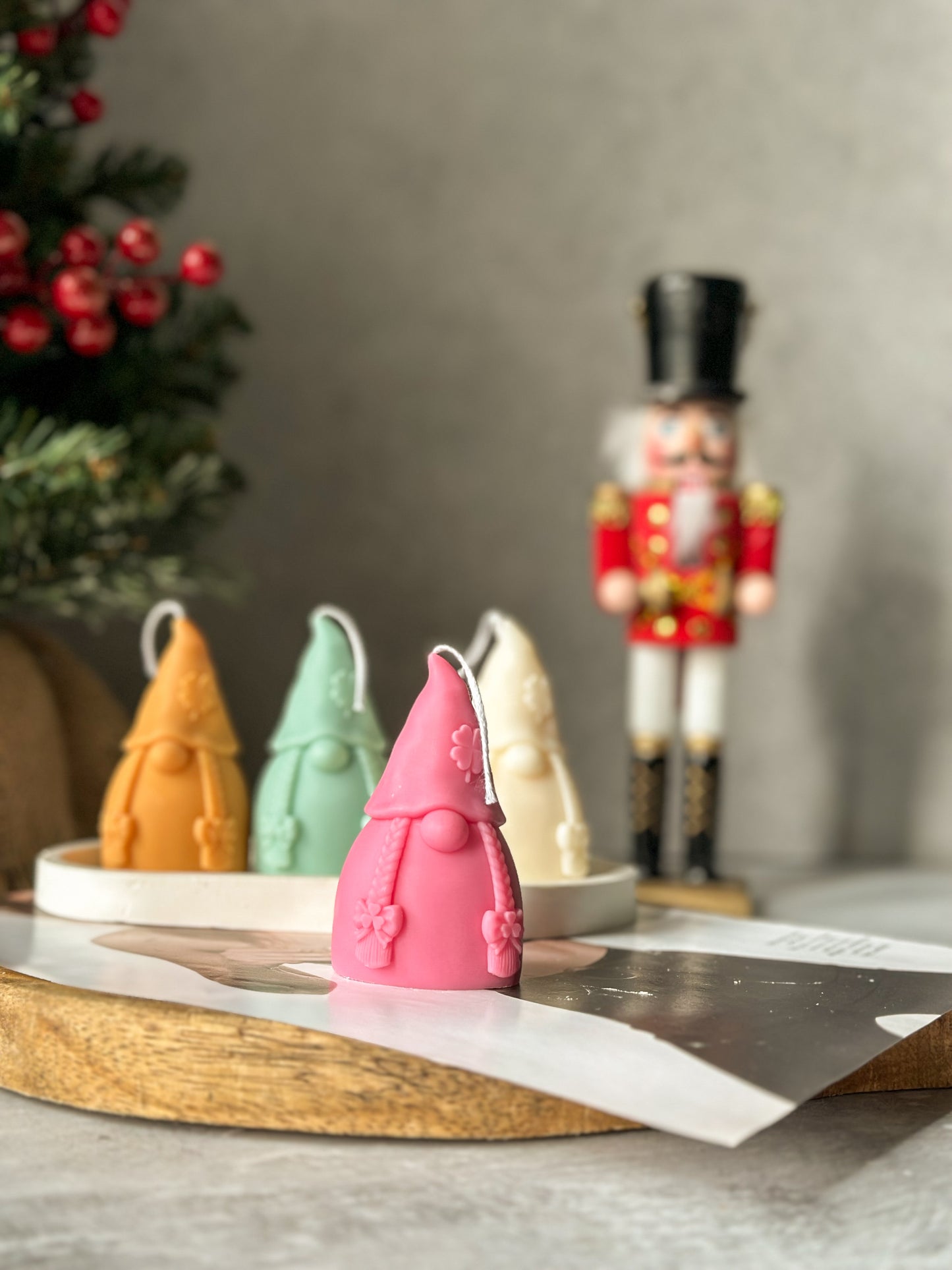 Pink Gnome Scented Candles with nutcracker and Christmas tree on the back.
