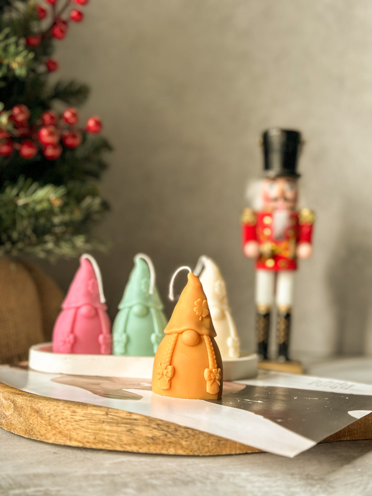 Brown Gnome Scented Candles with nutcracker and Christmas tree on the back.