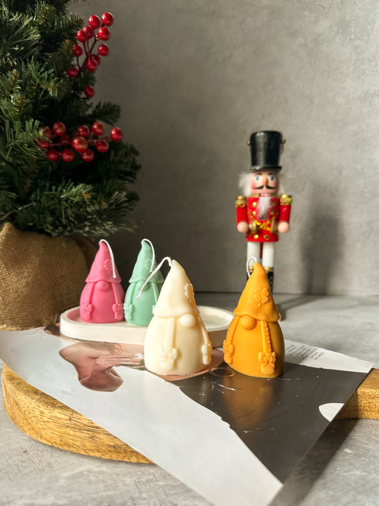 Gnome Scented Candles with nutcracker and Christmas tree on the back.