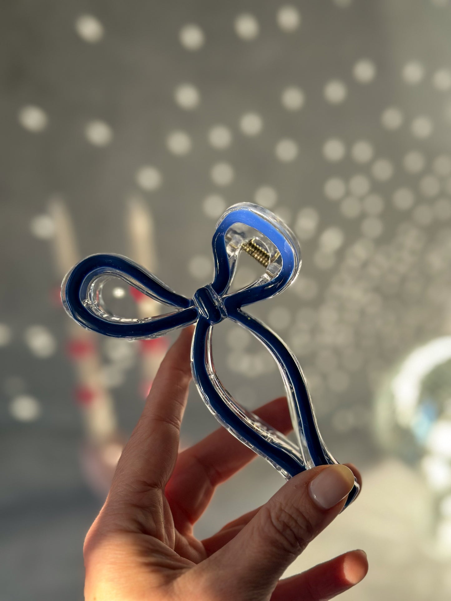Holding Dark Blue Bow Claw Clip