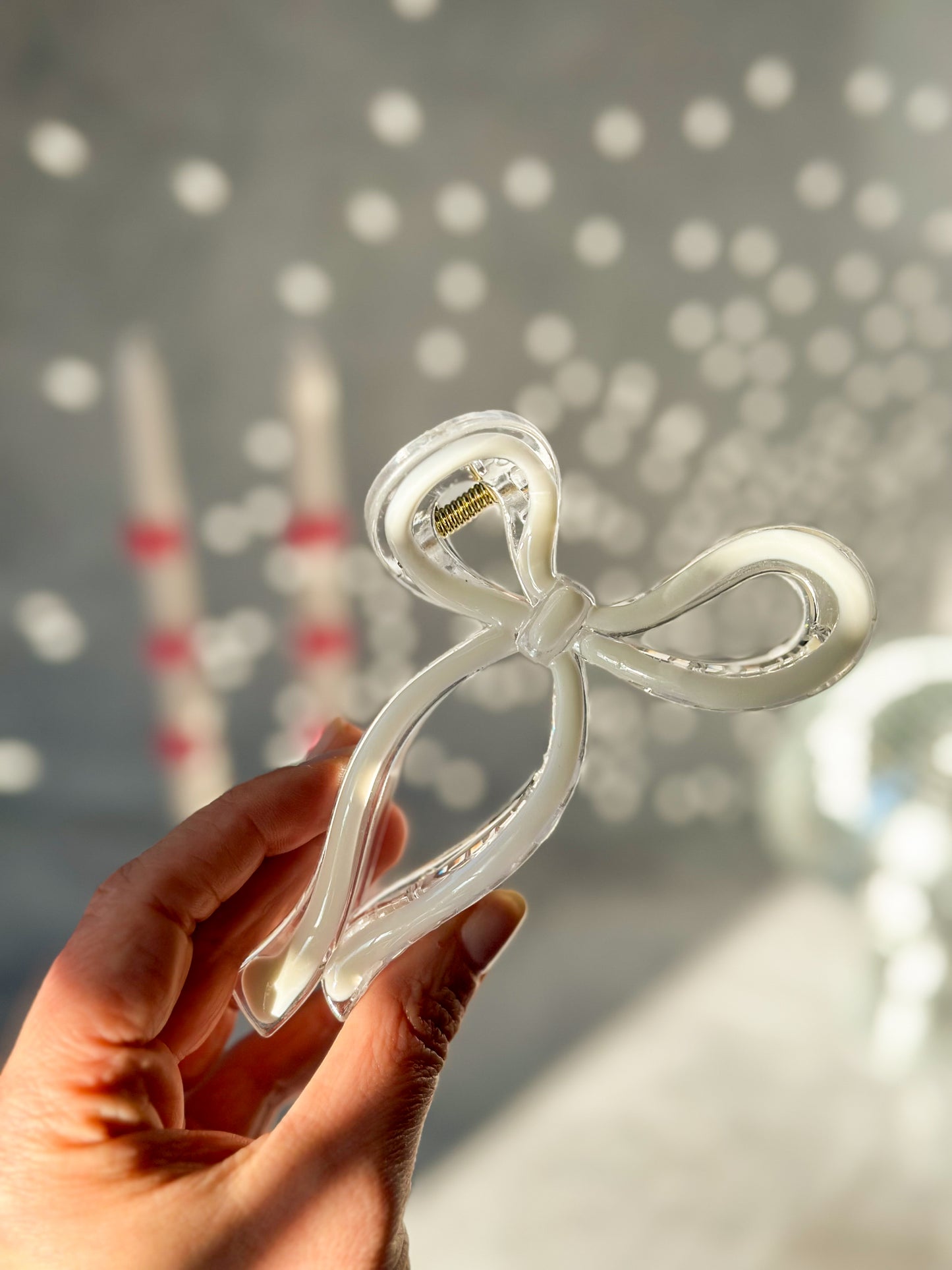 Holding White Bow Claw Clip