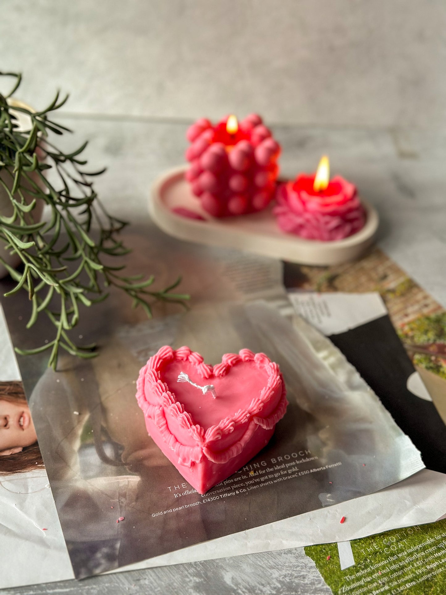 Pink Heart Shape Sweetheart Cake Candle burning candle on the background.