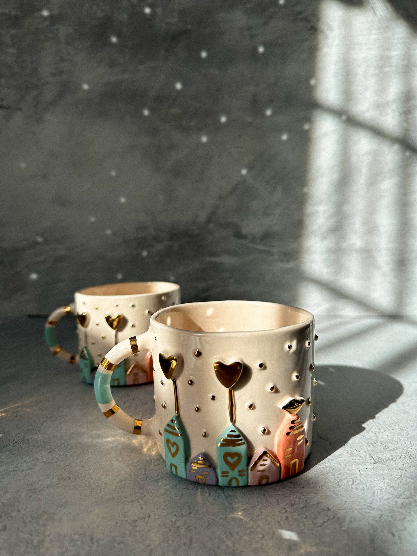 House detailed Ceramic Coffee or Tea Cup with gold hearts on it.
