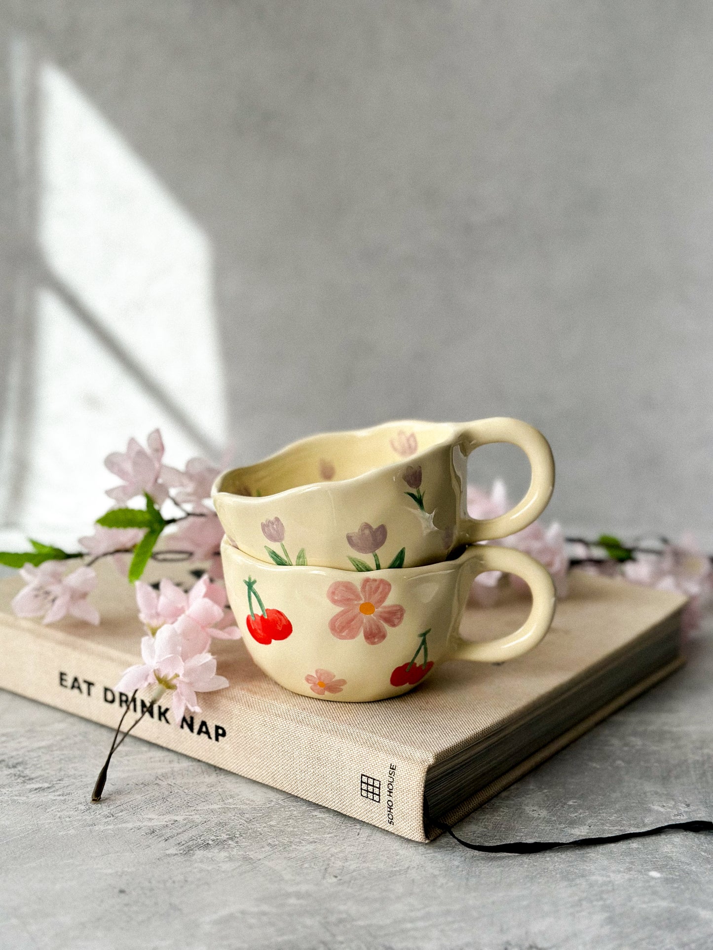 Two coffee mugs sitting together