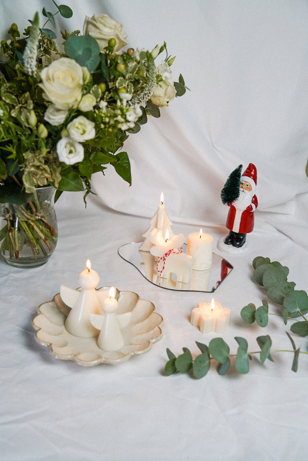 Christmas Angel Candles Set. Santa, Christmas tree and reindeer candles and flowers on the white background.