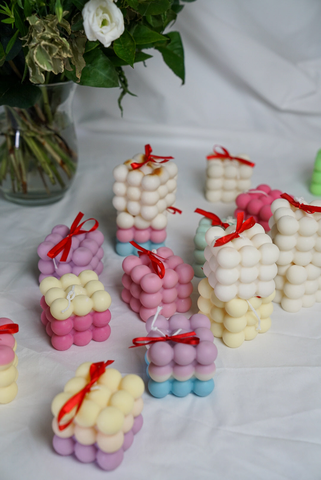 Colourful bubble candles with flower on the back