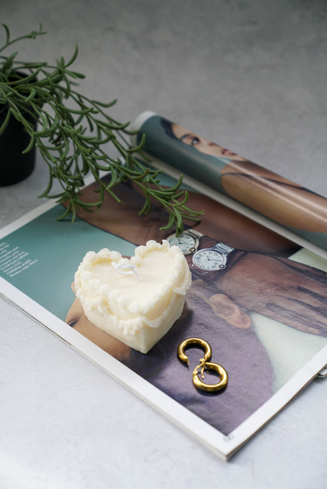 Heart Shape Sweetheart Cake Candle on a magazine.