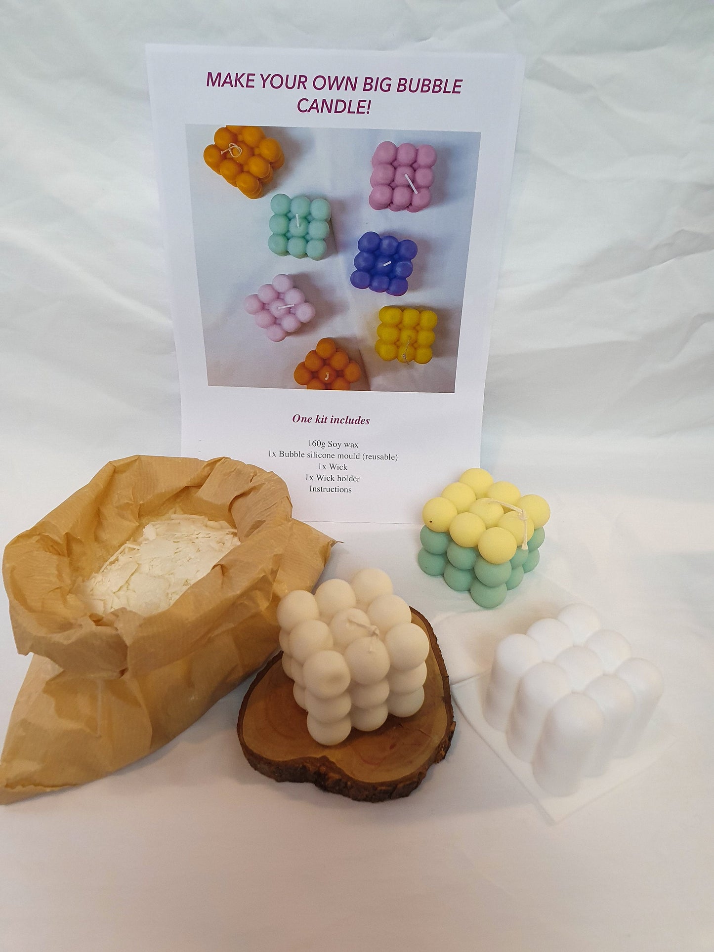 Make your own big Bubble Candle Making Kit with some bubble candles around and some wax in a brown bag.
