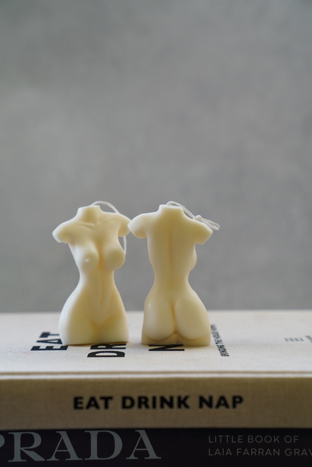 Female Torso Candles one front one from the back.