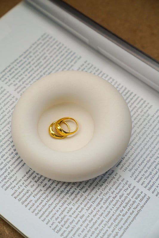 Asymmetric Jewellery Tray with rings in it on a magazine