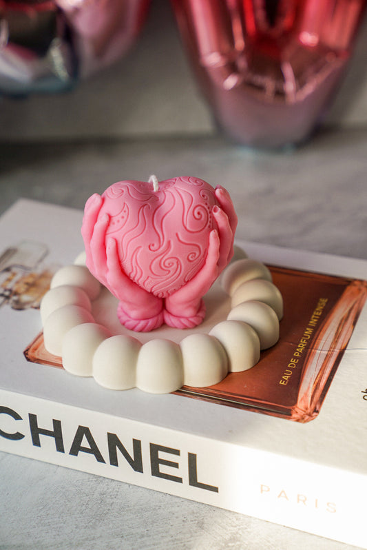 Hands Holding A Heart Candle in a bubble trinket tray.