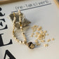 Necklace with shell shaped beads on a magazine page