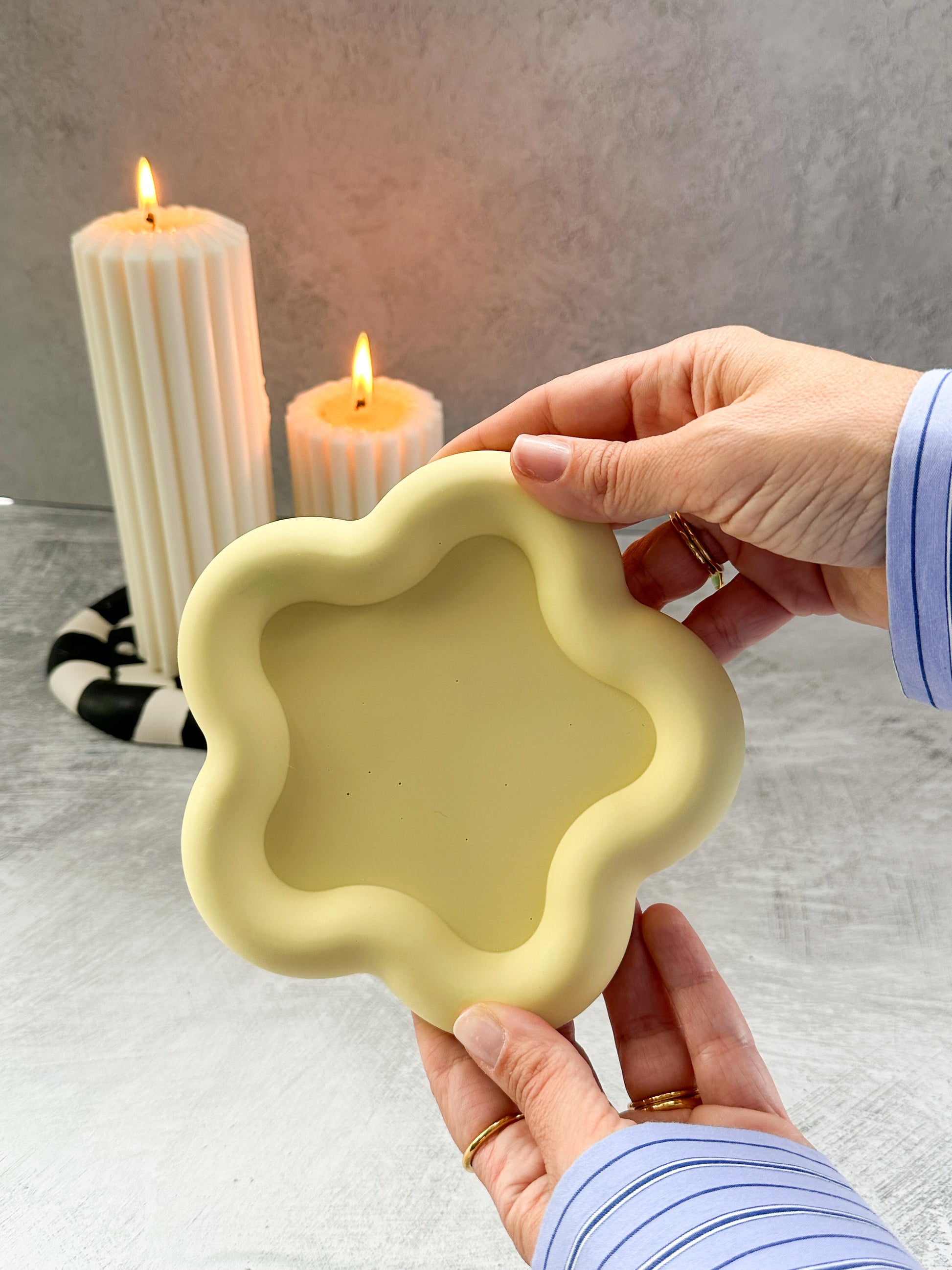 Holding yellow Flower Shaped Trinket Tray