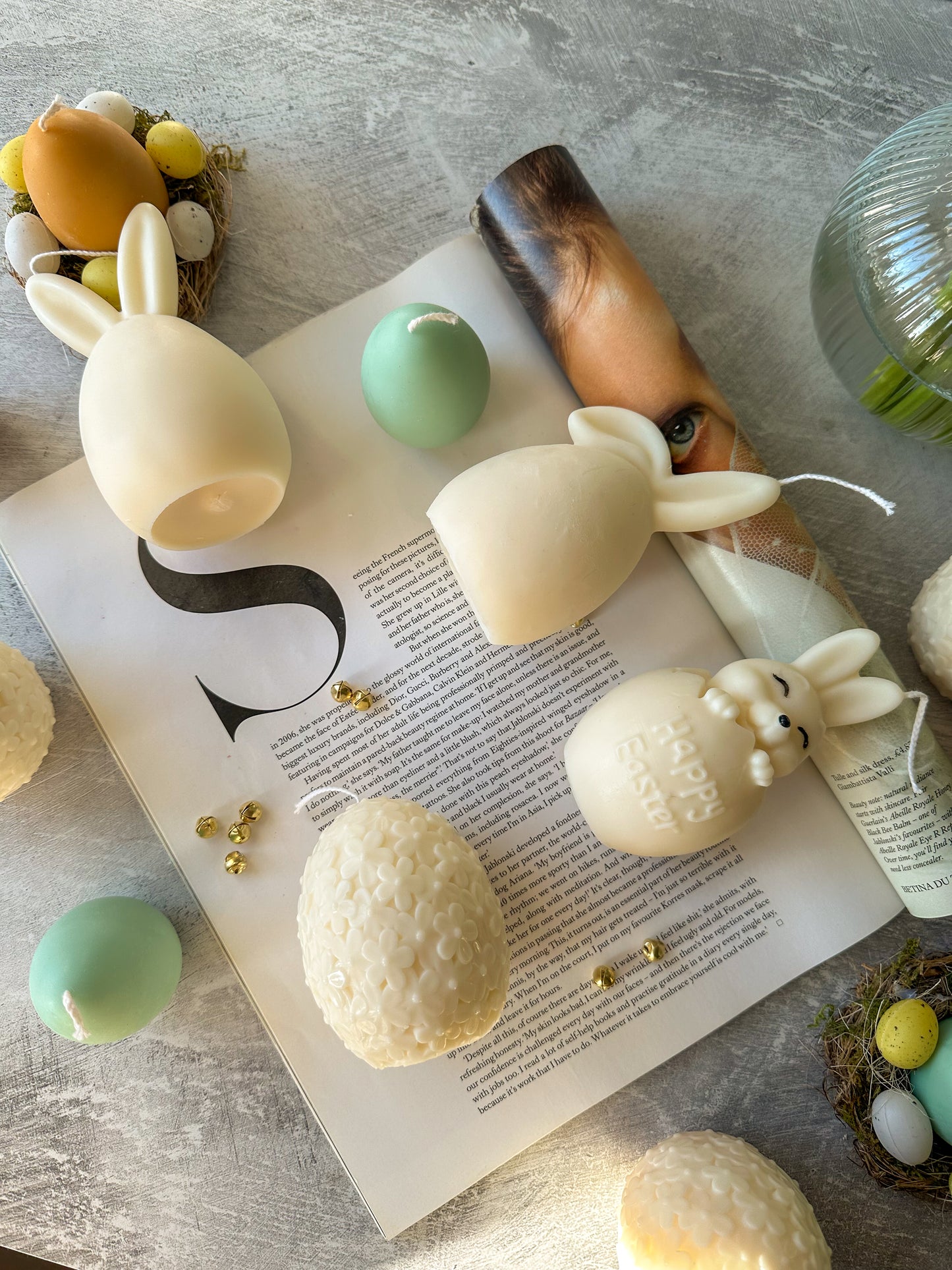 Easter Bunny Candles lying down on a magazine