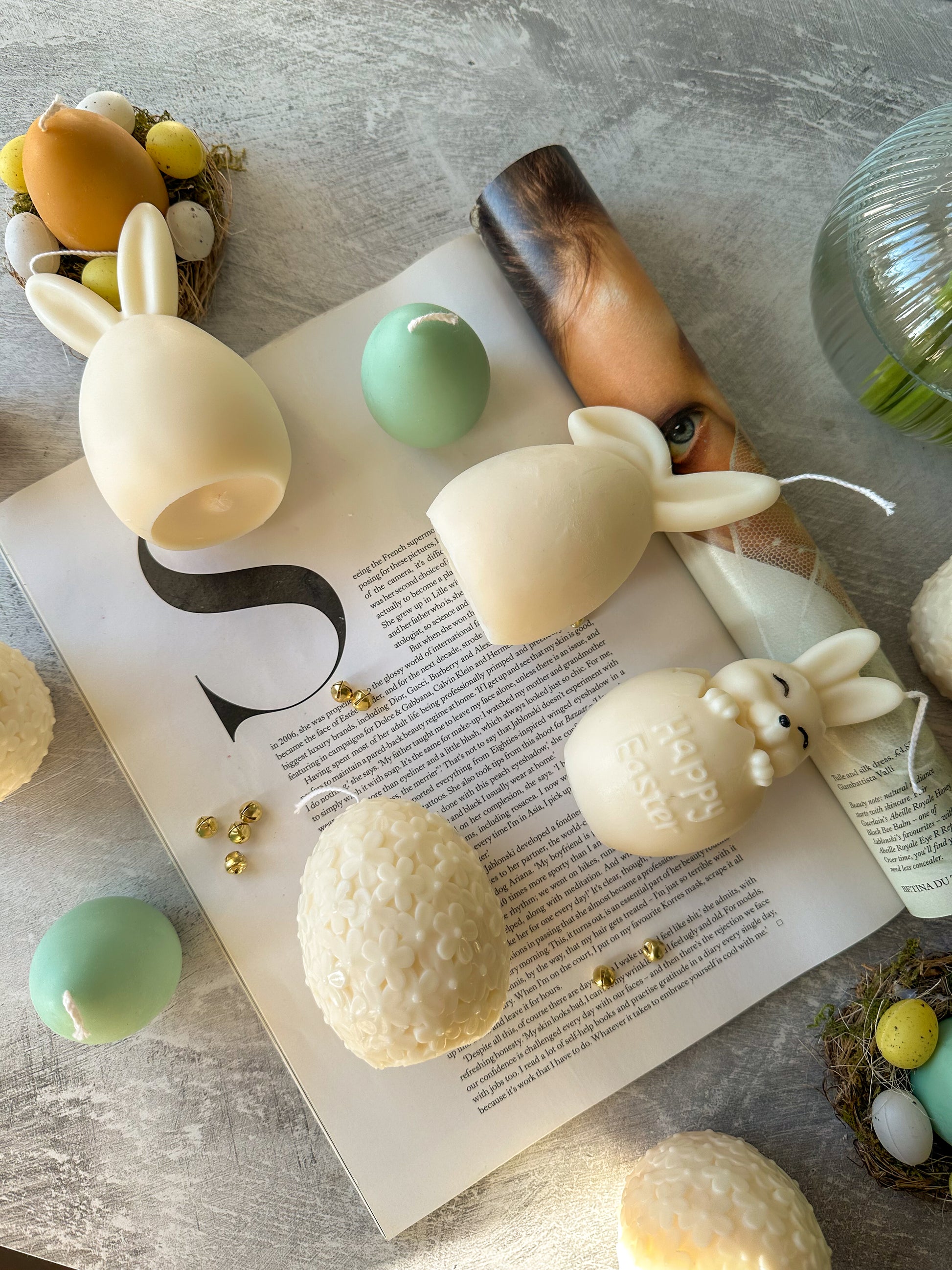 Easter Bunny Candles lying down on a magazine