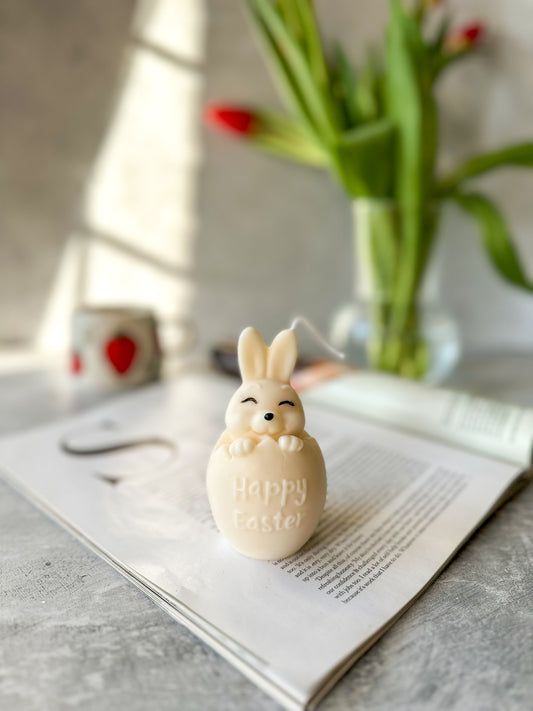 Easter Bunny Candle on a magazine.