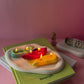 Chile Pepper Candles are red green and yellow sitting on the plate
