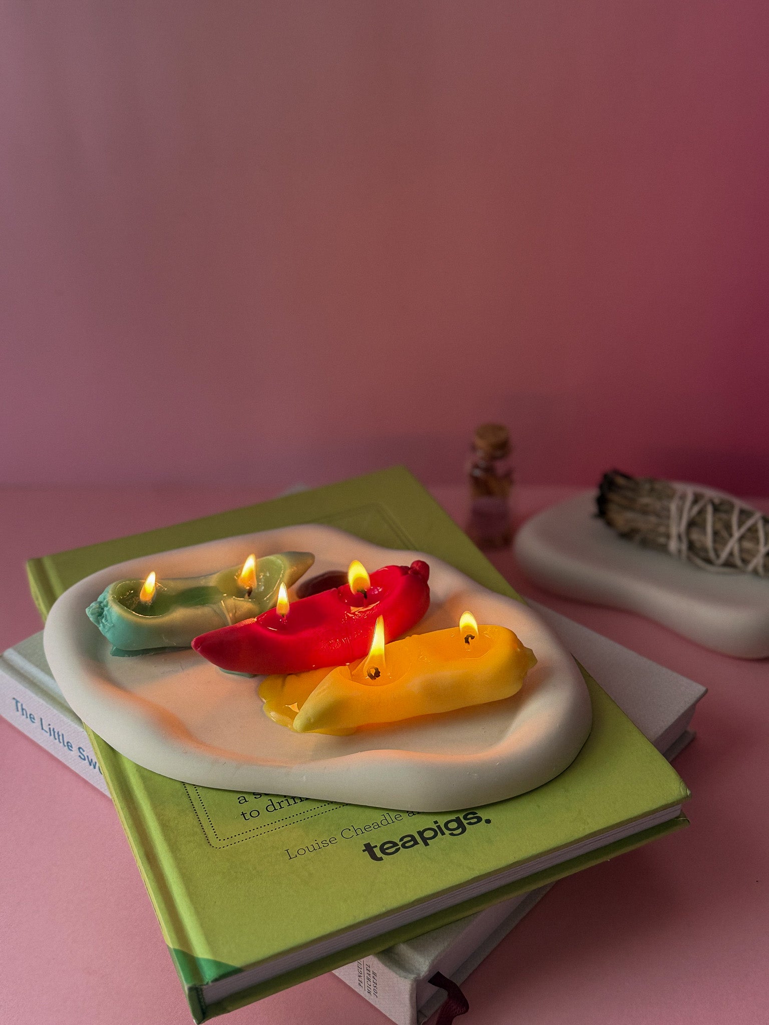 Chile Pepper Candles are red green and yellow sitting on the plate