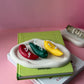 Chile Pepper Candles are red green and yellow sitting on the plate