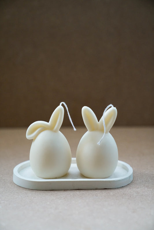 Ivory Easter Bunny Ear Up / Down Candles on a trinket dish. 