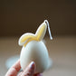 Holding Ivory Easter Bunny Ear Down Candle.
