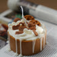Not edible Lotus Birthday Cake Candle on a magazine.