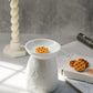 Butterfly Ceramic Wax Melter and Marshmallow Scented Waffle Shaped Wax Melt on the background geometric candle holder with twisted candle.