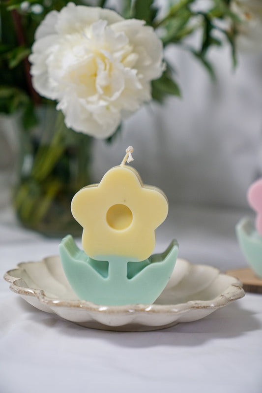 Yellow Flower Pillar Candle with rose background