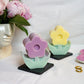 Lavender and Yellow Flower Pillar Candle with face vase on the background peonies in the vase