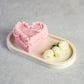 Heart Shape Sweetheart Cake Candle with little roses around it.