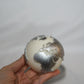 Holding Globe Candle with silver painted.