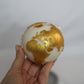 Holding Globe Candle with gold painted. 