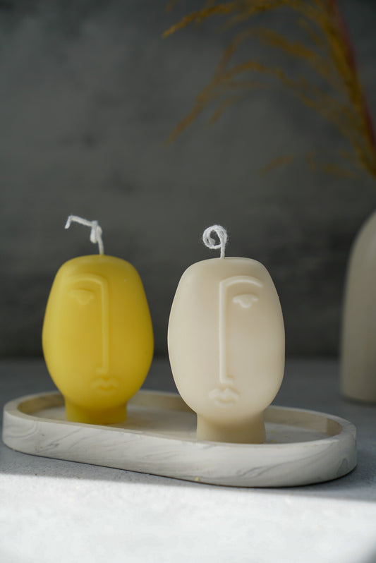 Abstract Face Soy Wax Candle White and Yellow on a trinket dish