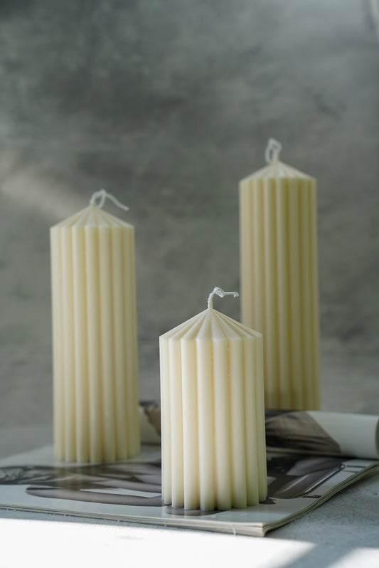 Corinthian Pillar Candle Set on a magazine with a grey background