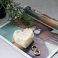 Heart Shape Sweetheart Cake Candle on a magazine. 