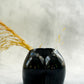 Black Concrete Booty Decorative Vase with dry flowers on it 